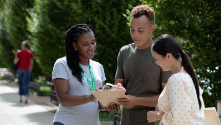 three people reviewing a checklist