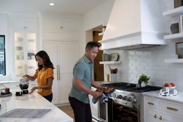 A couple cooking in a kitchen in a house in Huntington, WA