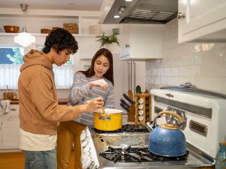 Two people in a kitchen inside a house in Morgantown, WV